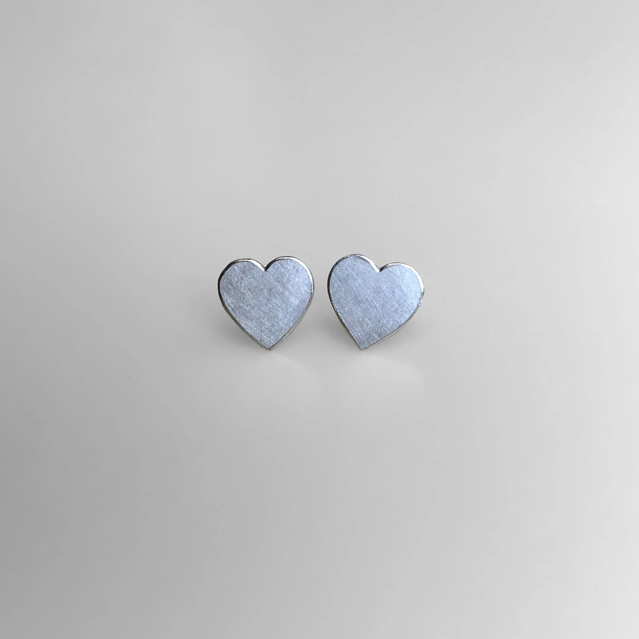 Heart stud earrings in sterling silver, medium